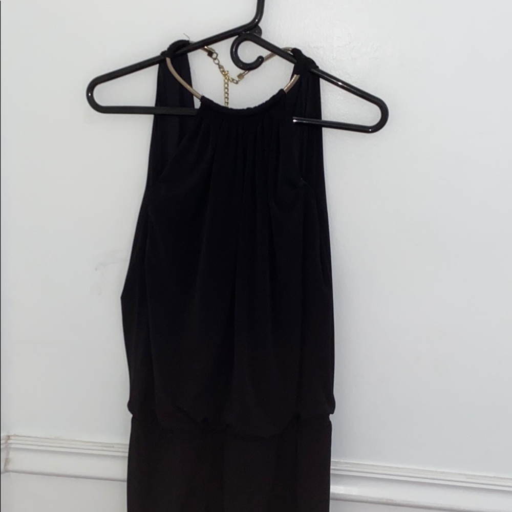 Black elegant dress with gold chain around neck